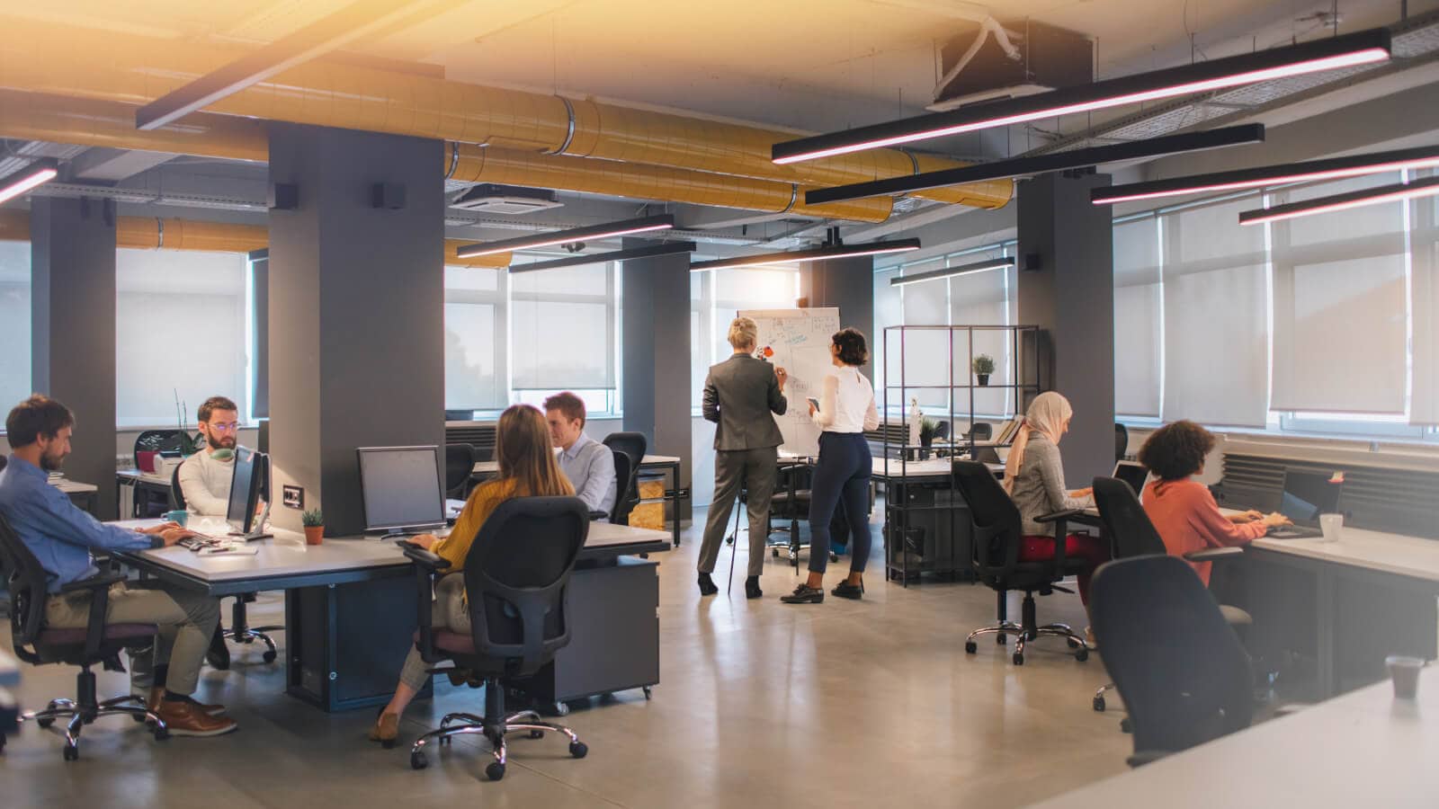 large office space with employees working