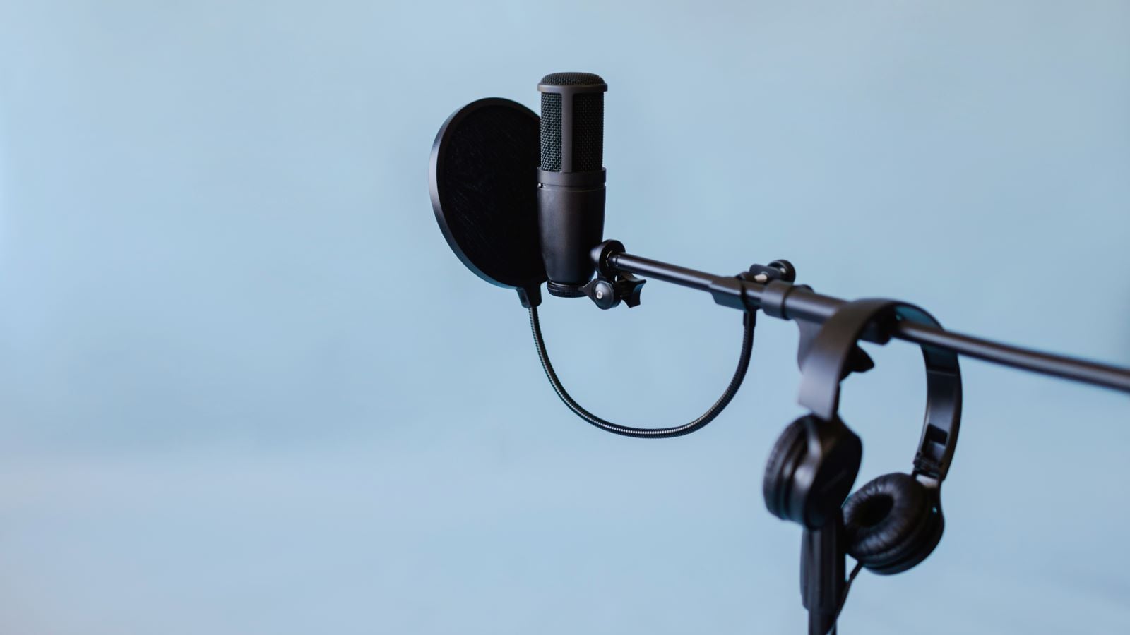 Microphone on stand with pop filter and headphones