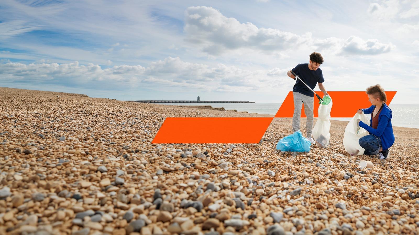 People collecting garbage on beach