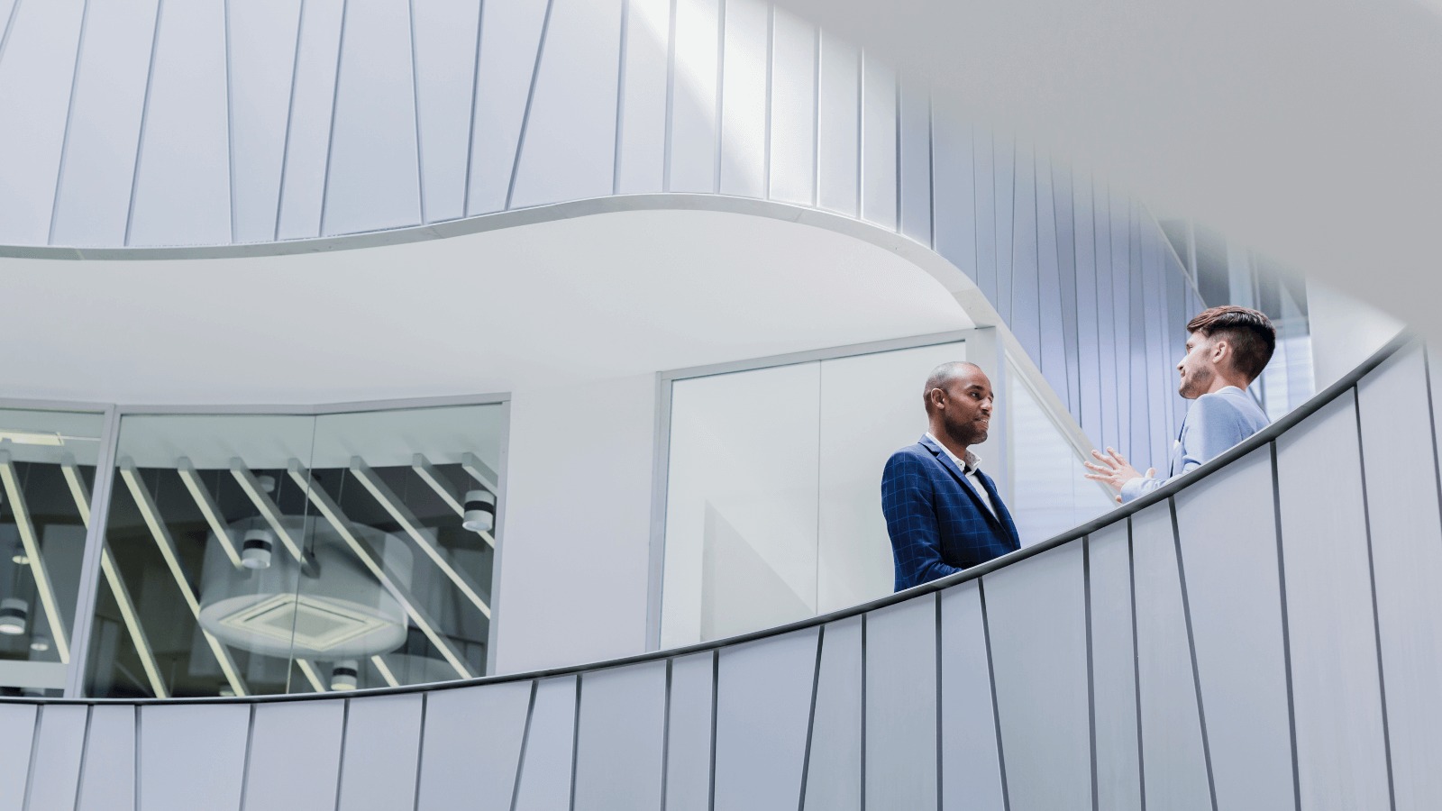 Image of two men discussing dispute and claims services.