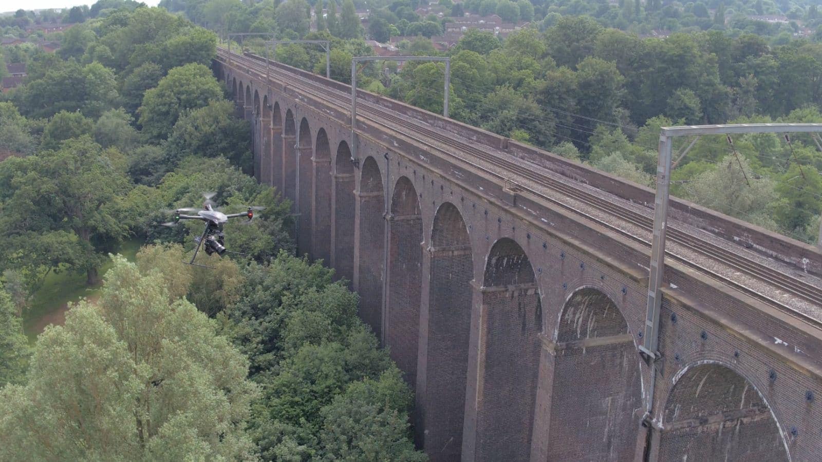 drone above railway bridge